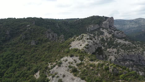 Aerial-drone-view-of-a-mountain-ridge-with-mediterranean-scrubland-in-Herault